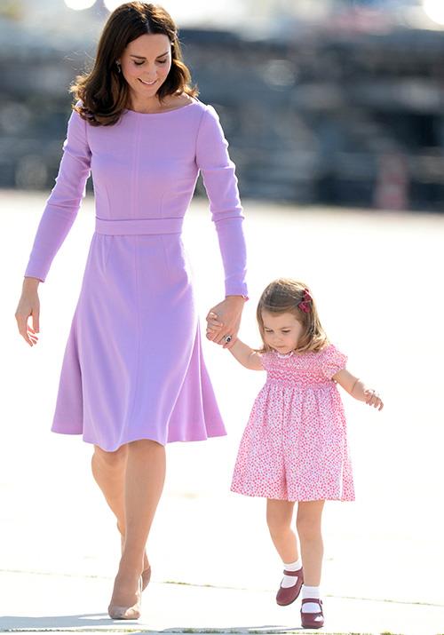 Royal pairing Duchess Catherine and Princess Charlotte look picture perfect in their adorable pastel pink and purple ensembles. *(Image: Getty Images)*