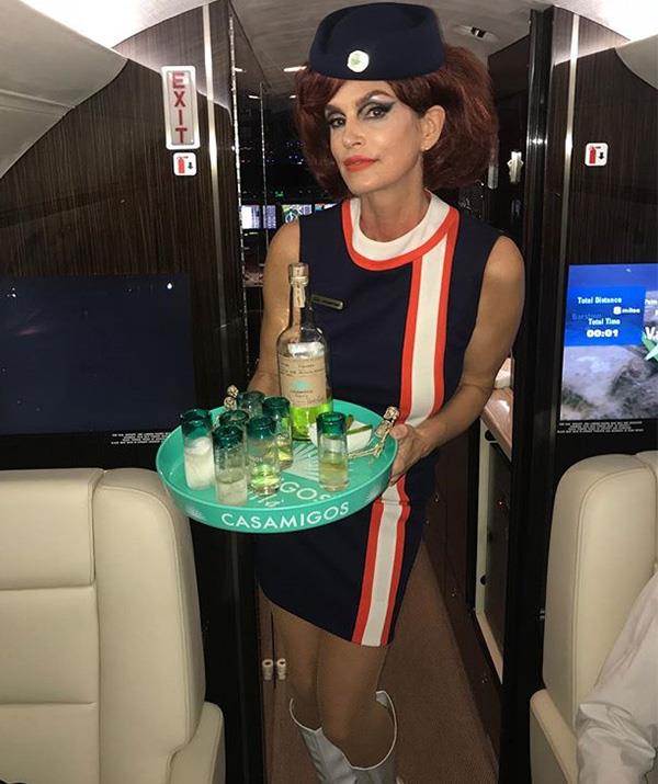 Come fly with... Cindy Crawford? The striking model nailed the outfit and has all the props to boot! *(Image: Instagram / @cindycrawford)*