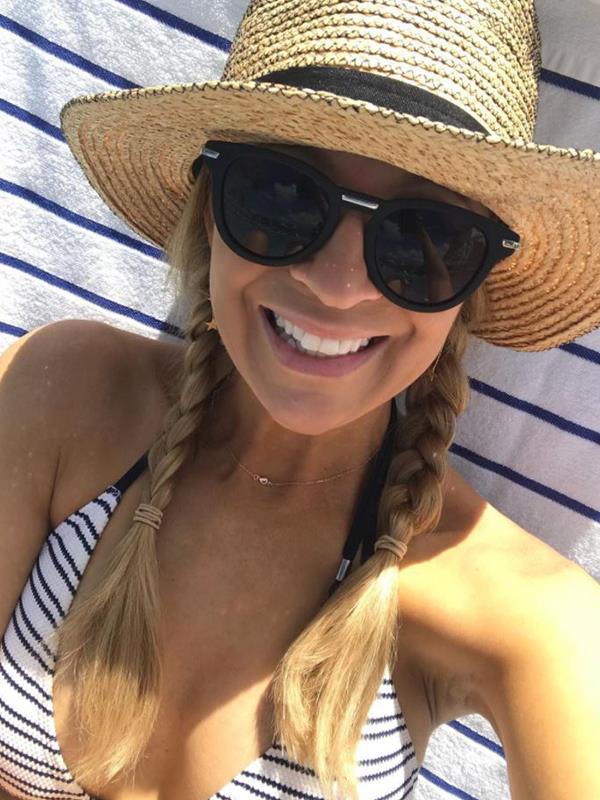 Carrie Bickmore knows how to stay sun safe. *(Image: Instagram @bickmorecarrie)*