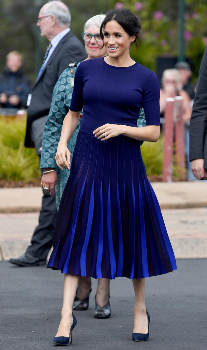 Stepping out to meet fans in Rotorua, the Duchess turned heads in this Givenchy top and skirt ensemble. *(Image: Getty Images)*