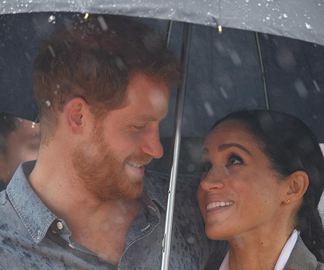 Harry and Meghan couldn't have looked more loved up during their royal tour Down Under. *(Image: Getty)*
