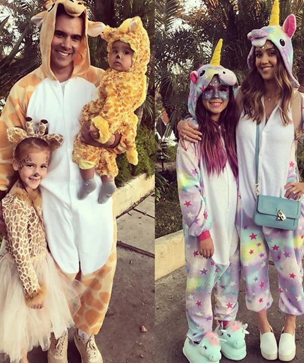 Jessica Alba and her family embraced onsies in full force, dressing as (rather fleecy) giraffes and unicorns. *(Image: Instagram: @jessicaalba)*