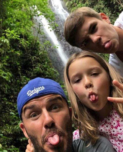 We can see the resemblance in these tongues... David, Harper and Romeo pull funny faces while on holidays. *(Source: Instagram)*