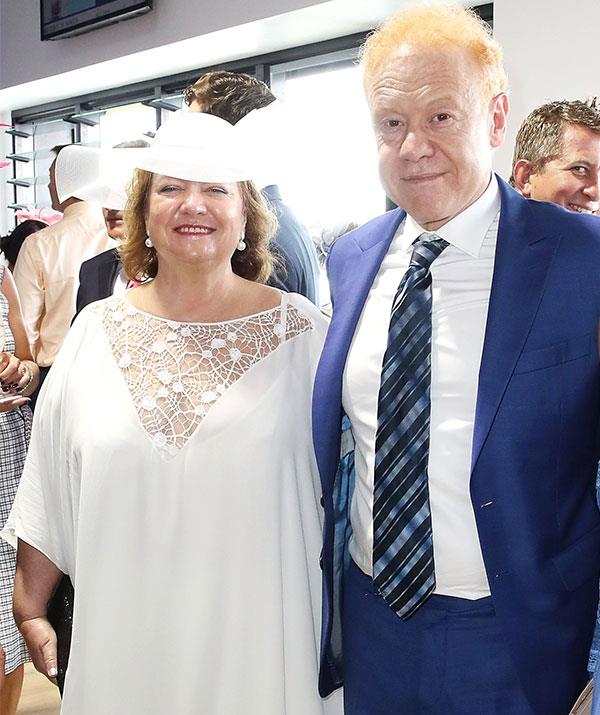 Power players! Mining magnate Gina Rinehart rubs shoulders with fellow billionaire Anthony Pratt at the Melbourne Cup.*(Image: Getty)*
