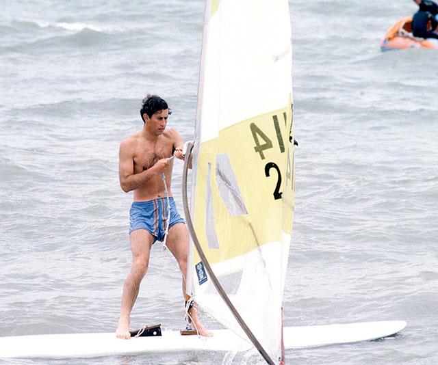 What can't he do? Prince Charles windsurfs in Deauville, France in 1978. *(Image: Getty)*