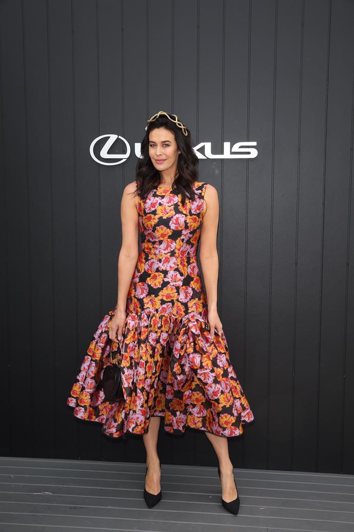 Aussie darling and model, Megan Gale's festive floral gown is a head turner. *(Source: Media Mode)*