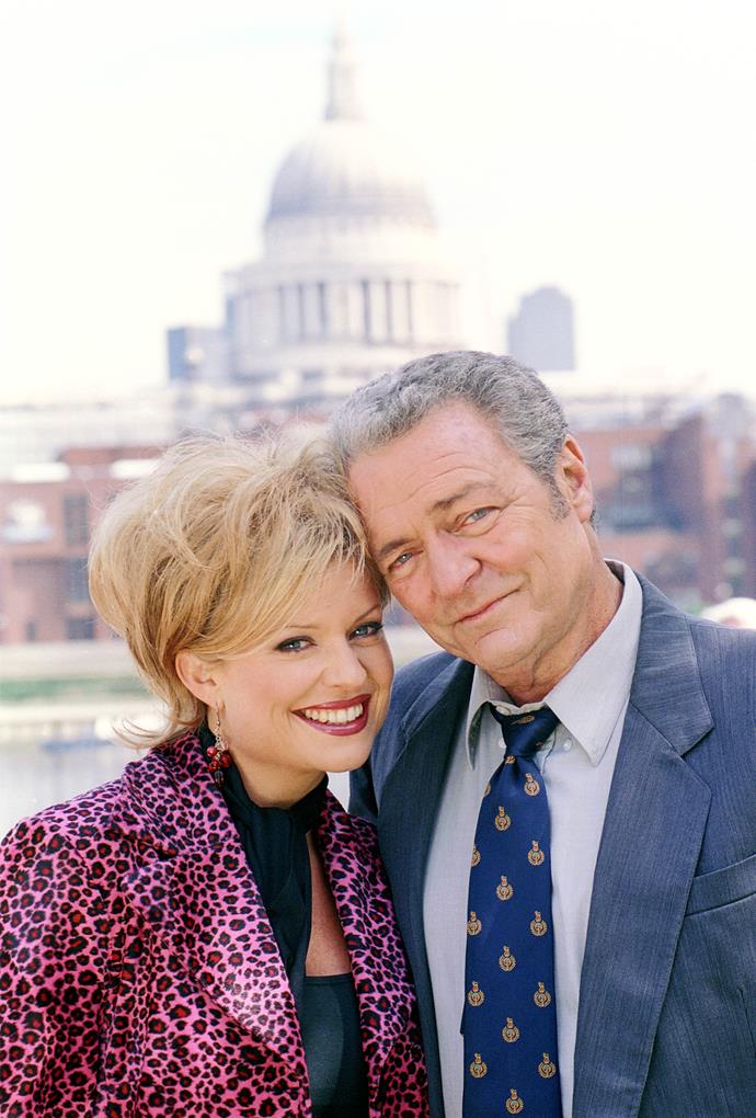 **27. Marilyn & Donald**
<br><br>
No-one in Summer Bay expected straight-laced Summer Bay High principal Donald Fisher (Norman Coburn) to fall for bubbly beautician Marilyn [[Emily Symons](https://www.nowtolove.com.au/celebrity/tv/home-and-away-john-marilyn-fight-62765|target="_blank")]. Donald was old enough to be Marilyn's father, but the odd couple surprised everyone by getting engaged. After getting married in 1996, Marilyn and Donald welcomed a baby boy, who they named Byron.