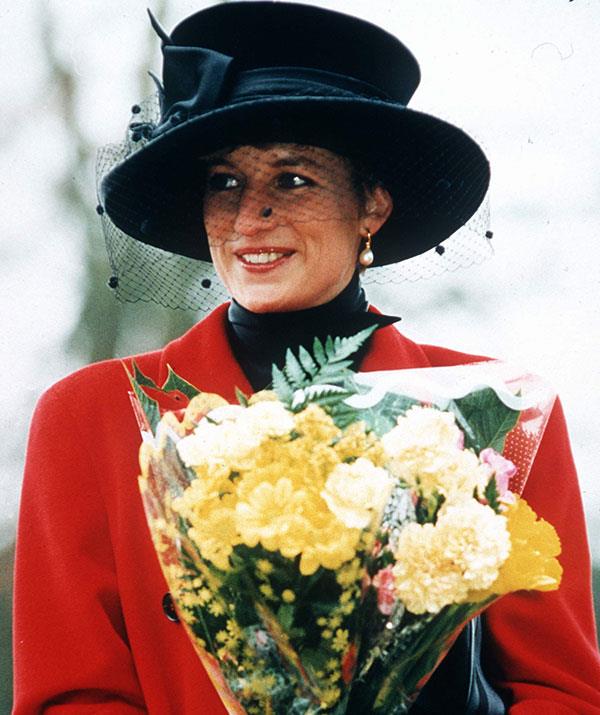 Princess Diana in a broad-brimmed hat with a dramatic veil during Christmas morning at Sandringham in 1993.