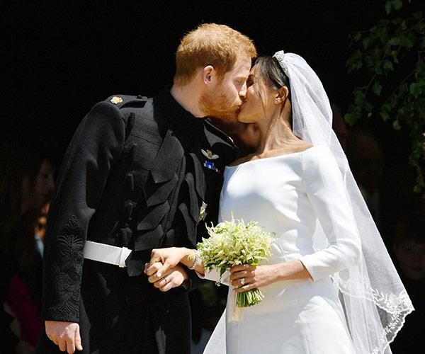 Sealed with a kiss: The newlyweds were watched by billions. *(Image: Getty Images)*
