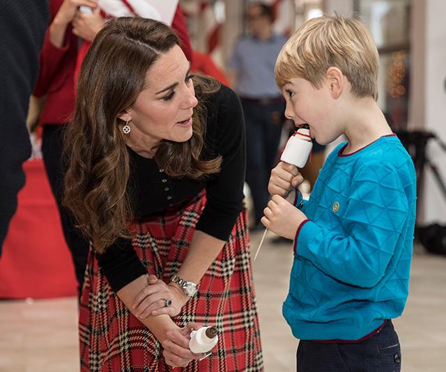 Always a natural with kids, Kate had many animated discussions with the young guests at the event. *(Image: Getty)*