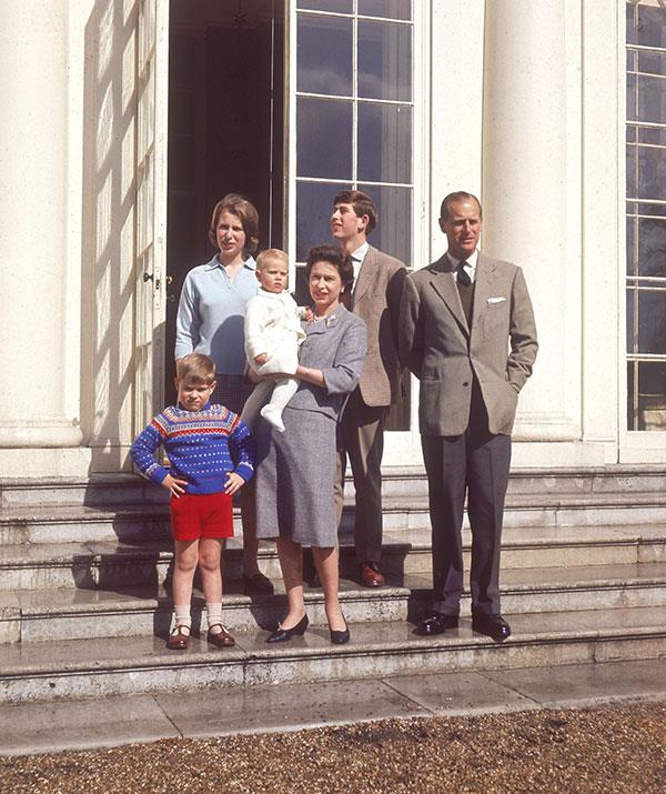 We recognise those stairs! Decades earlier in 1965 The Queen and Prince Philip posed with their children Prince Andrew, Princess Anne, a baby Prince Edwards and Prince Charles on the steps of Frogmore House. *(Image: Historia/REX/Shutterstock)*