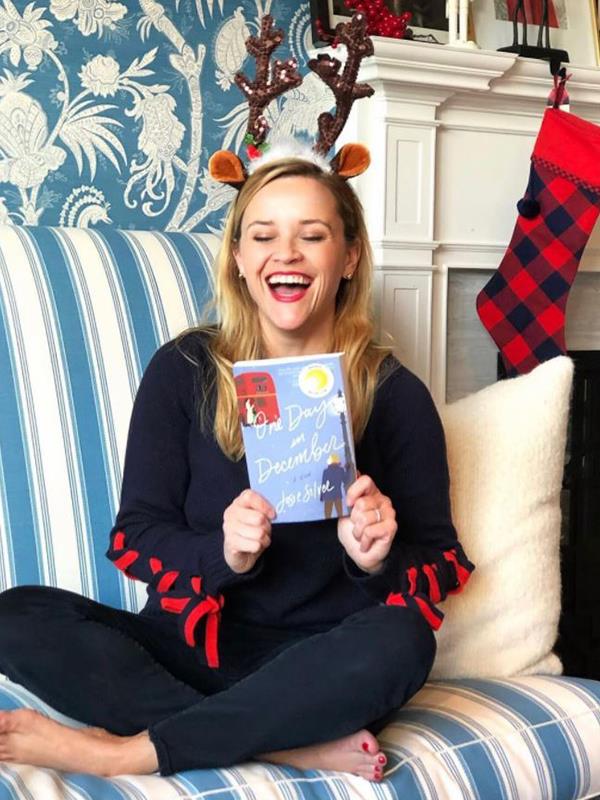 *Legally Blonde* star Reese Witherspoon is cosying up this silly season with some of her favourite books. *(Image: @reesewitherspoon Instagram)*