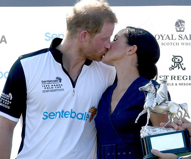 In a rare royal moment, Chris captured a sweet kiss between the newly wedded Harry and Meghan as they attended a polo match in July - this image will no doubt be shared for years to come! *(Image: Chris Jackson / Getty Images)*