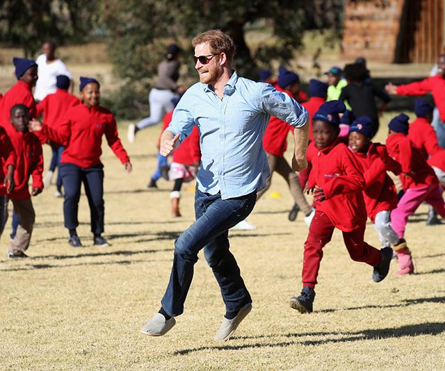 Ever the young-soul, Prince Harry ran amok with school children as he visited Maseru, Lesotho in June shortly after his royal wedding. *(Image: Chris Jackson / Getty Images)*