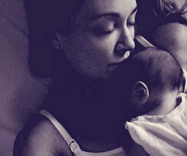 Baby Axel having a cuddle with his mum.*(Image: Instagram @mishbridges)*