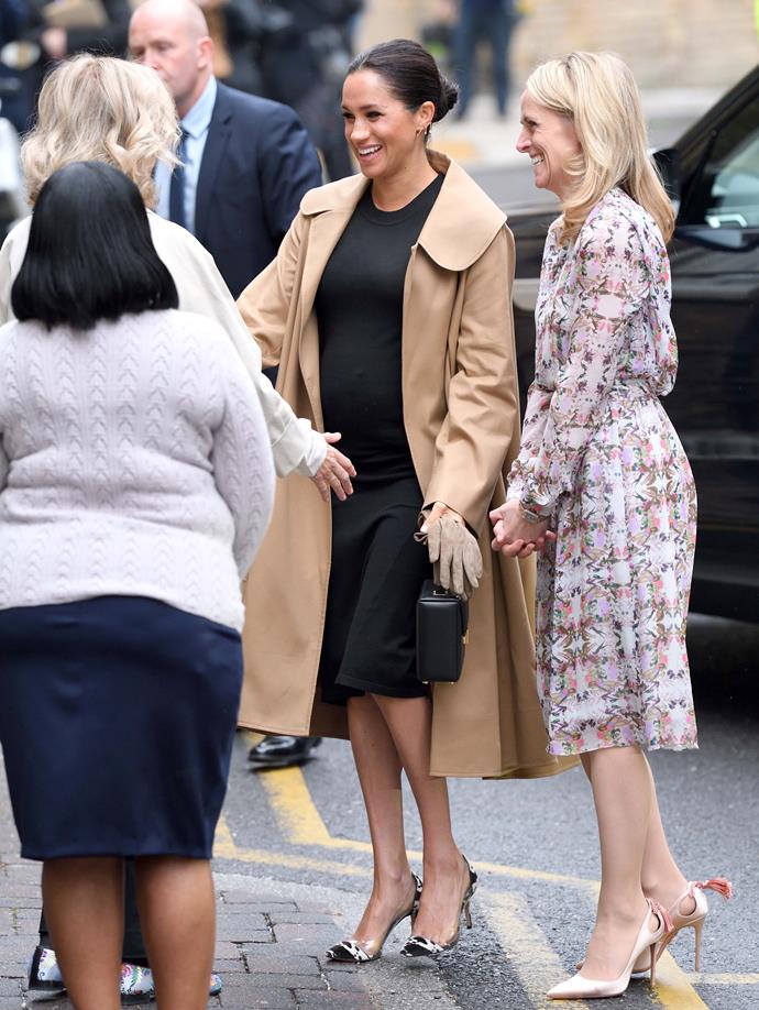 In January, Meghan [visited female employment cause Smart Works](https://www.nowtolove.com.au/royals/british-royal-family/meghan-markle-announces-patronages-53471|target="_blank"), of which she has just been made a patron of, wearing a black maternity dress by US label Hatch, Kimai earrings and a long Oscar de la Renta camel coat. *(Image: Getty Images)*