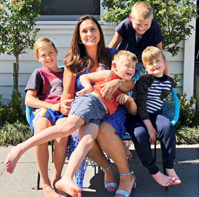 Shane and his wife Olivia have their hands full with four boys (Image: Instagram).