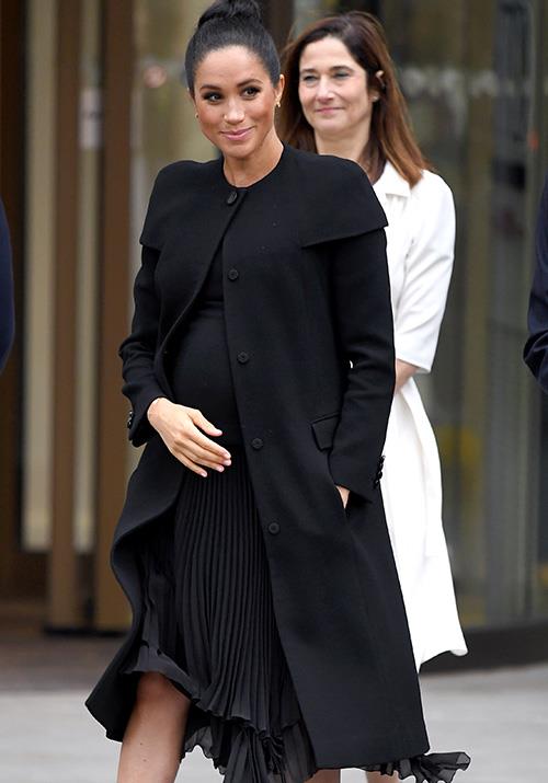 The Duchesses all-black Givenchy ensemble was paired with nude Manolo Blahnik pumps and earrings by Dean Davidson. *(Image: Getty Images)*