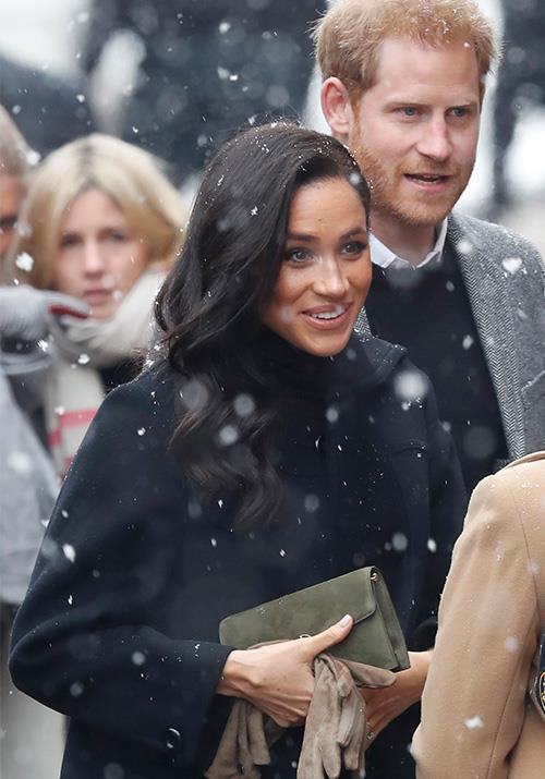 Stepping out in snowy Bristol on Friday, February 1, the royal parents-to-be were well and truly wrapped up warm - but that didn't stop Meghan from looking stylish as ever. *(Image: Getty Images)*