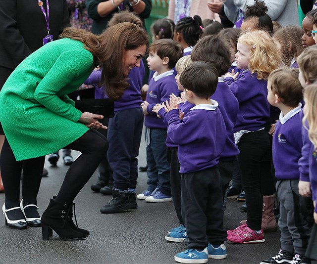 The duchess doesn't just use the technique with her own children. You'll see her kneeling down to talk all children she greets. *(Image: Getty)*