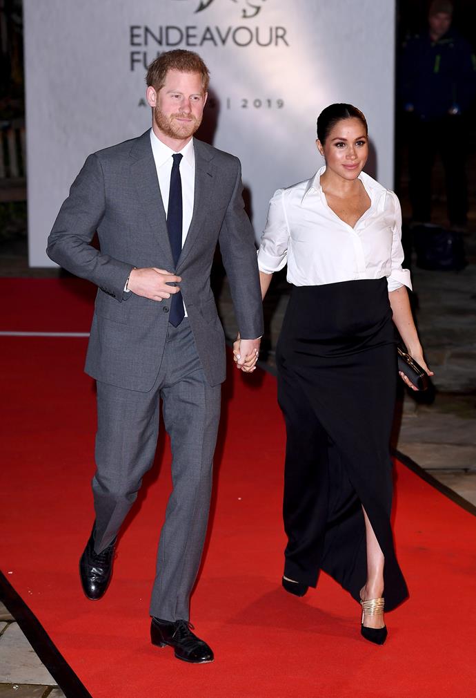 On February 7, Harry and Meghan stepped out together in London on the red carpet at the Endeavour Fund Awards, with Meghan in a stunning head-to-toe Givenchy shirt and skirt combo, paired with $966 Aquazzura 'Rendez Vous' pumps. *(Image: Getty)*