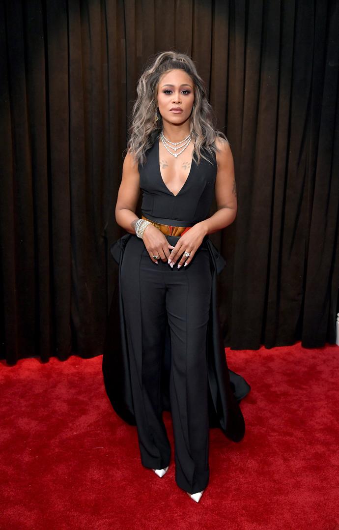 Singer Eve's pant suit is edgy and chic. *(Image: Getty)*