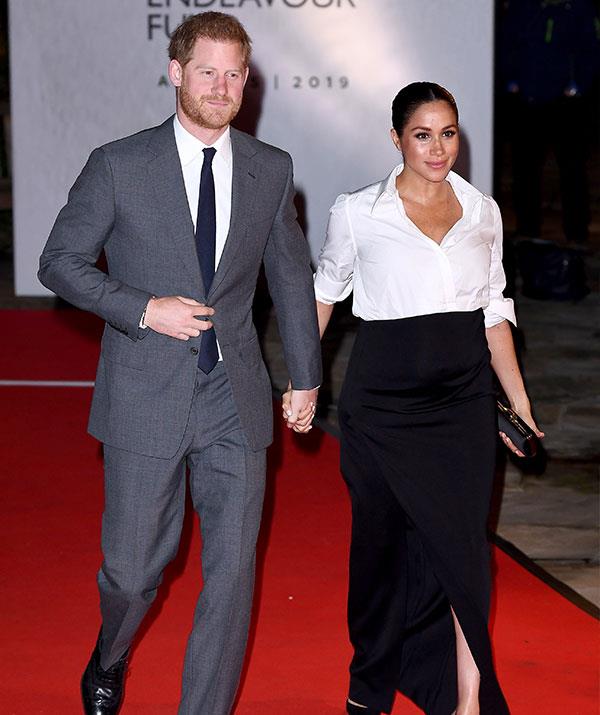 Prince Harry found the shrine to wife rather amusing. *(Image: Getty)*