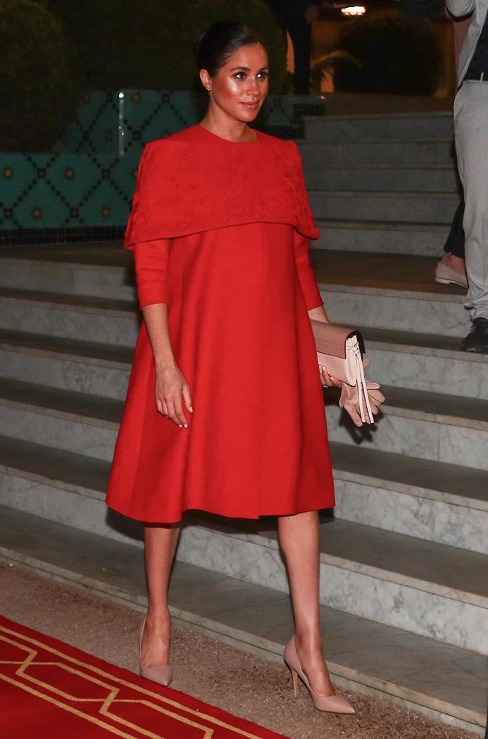 The Duchess looked stunning in a red Valentino gown. *(Image: Getty)*