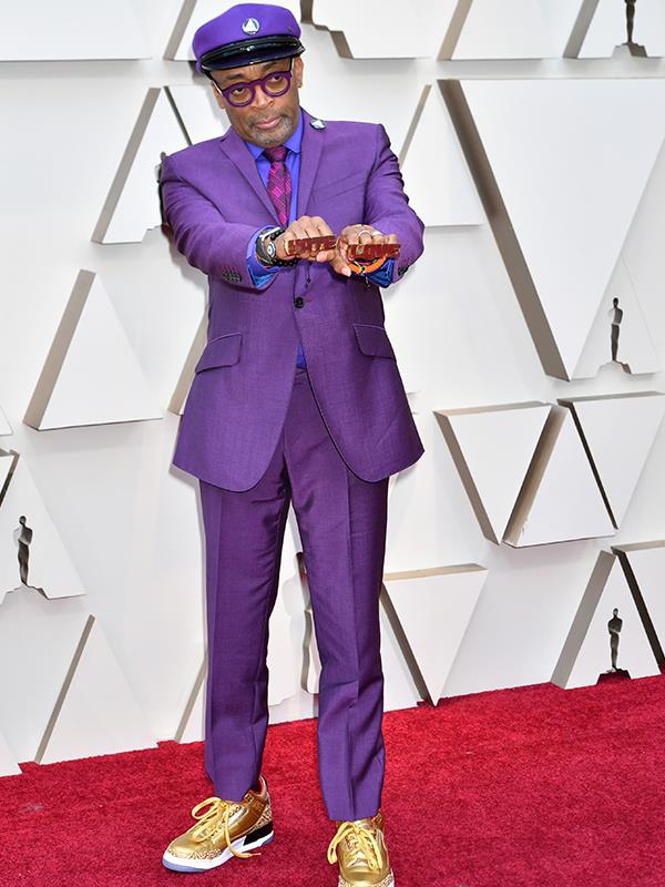 Best director nominee Spike Lee clashes spectacularly with the red carpet in a purple suit.