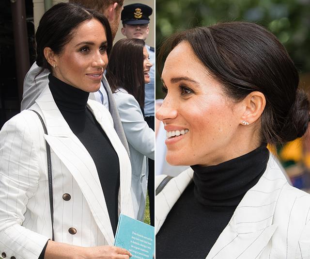 During her [royal tour of Australia](https://www.nowtolove.com.au/parenting/celebrity-families/meghan-markle-baby-bump-52010|target="_blank") in October 2018, Meghan once again proved there's nothing like a high neckline and a bountiful bun. 