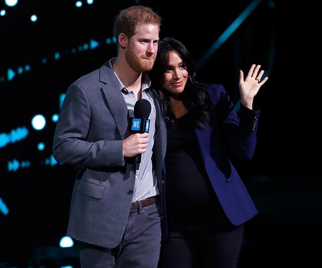 Prince Harry delivered a rousing speech before asking his wife to join him on-stage. *(Image: Getty)*