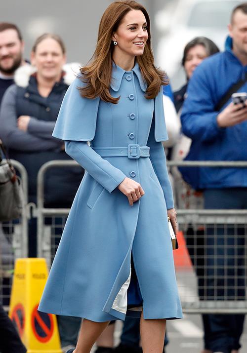 Royal power dressing: Kate's Mulberry blue capelet coat is nothing short of dreamy. *(Image: Getty)*