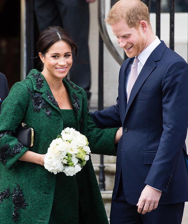 The heavily pregnant yet oh-so-stylish royal paired the stunning embellished coat with her Givenchy purse and Aquazzura bow pumps. *(Image: Getty Images)*