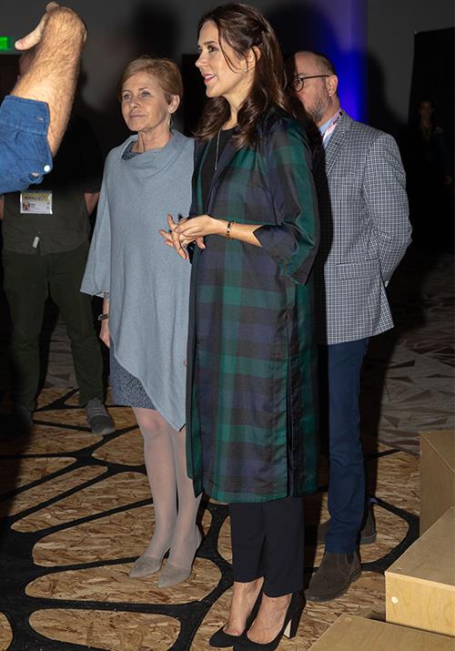 **March 2019, Texas**
<br><br>
While on an official royal visit to Texas, Crown Princess Mary wore a trendy green and black tartan coat - not unlike similar tartan styles worn by Duchesses Meghan and Catherine in the past!  
*(Image: Getty)*