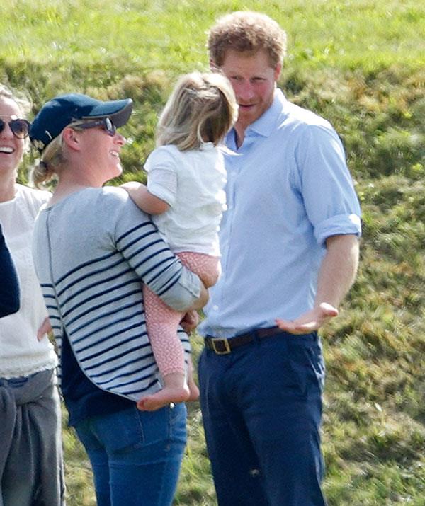 Zara's daughter Mia plays with the prince at the polo.
