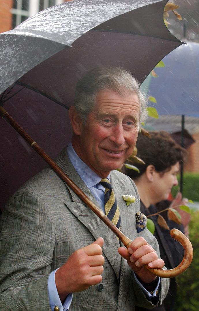 The rain doesn't seem to be bothering Prince Charles at all! *(Image: Getty)*