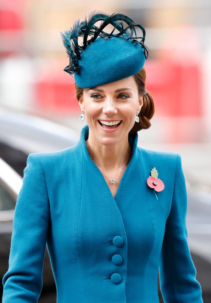 Kate looked stunning in a Catherine Walker coat, while her unique hat was designed by Rosie Olivia. *(Image: Getty)*