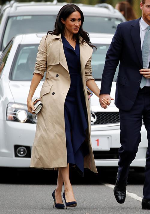 Meghan's Martin Grant trench coat worn while she visited Melbourne was all kinds of chic. *(Image: Getty)*