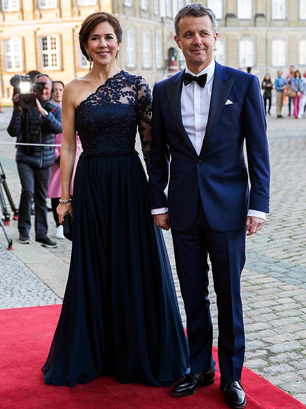 **Crown Princess Mary of Denmark**
<br><br>
Let's not forget our favourite Aussie-turned international royal - the one and only Crown Princess Mary *knows* how to nail the style stakes, and that's [exactly what she did](https://www.nowtolove.com.au/royals/international-royals/crown-princess-mary-princess-benedikte-birthday-55357|target="_blank") in April 2019 wearing this stunning midnight-blue gown for Princess Benedikte's birthday bash.
