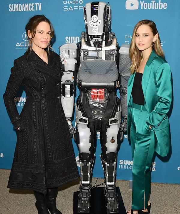 Swank and Rugaard at the 2019 Sundance premiere of *I Am Mother*. *(Getty)*