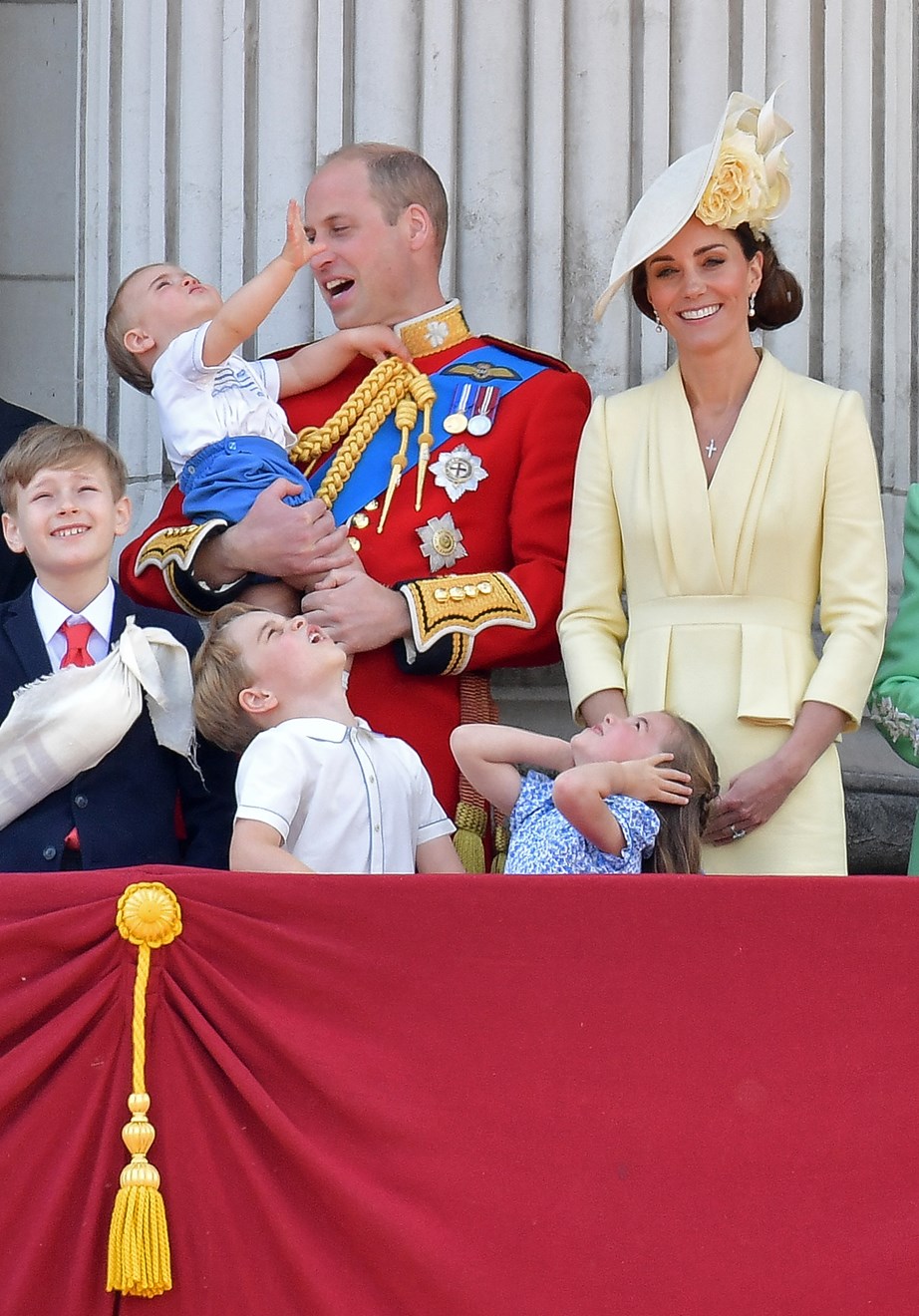 Princess Charlotte had the right idea, protecting her royal ears from the loud jet planes. *(Image: Getty)*