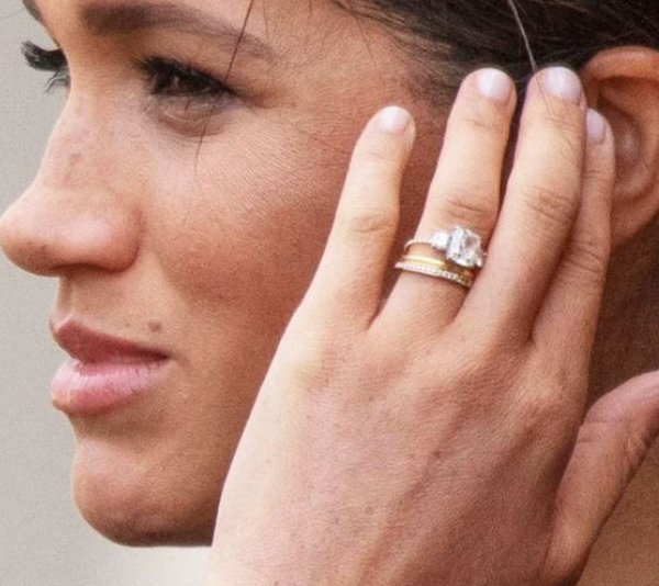 Though it was designed by Harry, the two smaller diamonds on Meghan's engagement ring come from Diana's collection.