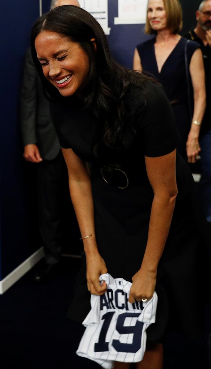 Meghan looked thrilled with the wardrobe addition for her new son!