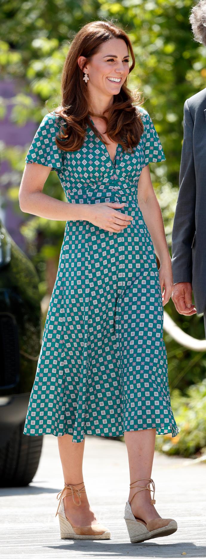 Weeks later, Kates had yet another golden summer moment when she wore this beautiful Sandro Paris dress featuring a trendy geometric print to [Hampton Court](https://www.nowtolove.com.au/royals/british-royal-family/kate-middleton-hampton-court-garden-56761|target="_blank"). She's the summery gift that never stops giving!
