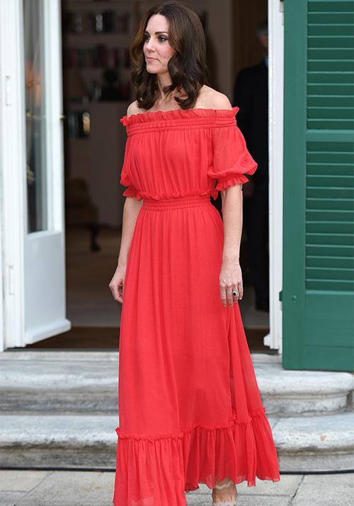 Attending a birthday party for the Queen that same year, Kate brought a pop of colour to her surroundings in this off-shoulder Alexander McQueen frock. We can't get enough of the ruched detailing!