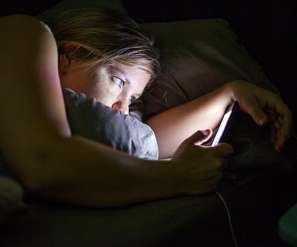 Try to avoid glancing at your phone for at least two hours before bedtime.