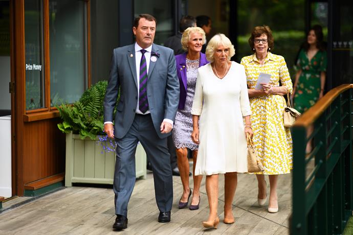 Camilla looked lovely in a fresh white dress.