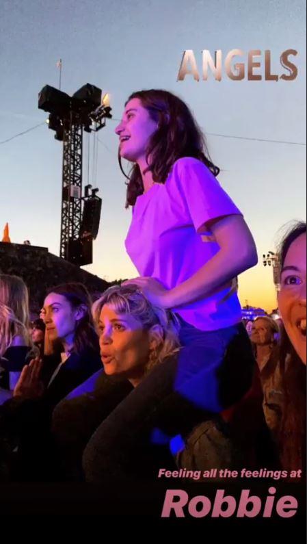 Spotted! Tiger Lily Hutchence was snapped on half sister Pixie Geldof's shoulders at Robbie Williams' British Summer Time gig in London's Hyde Park.
