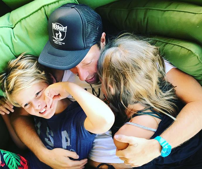 Gywneth shared this Insta snap of Chris hugging the couple's two kids.