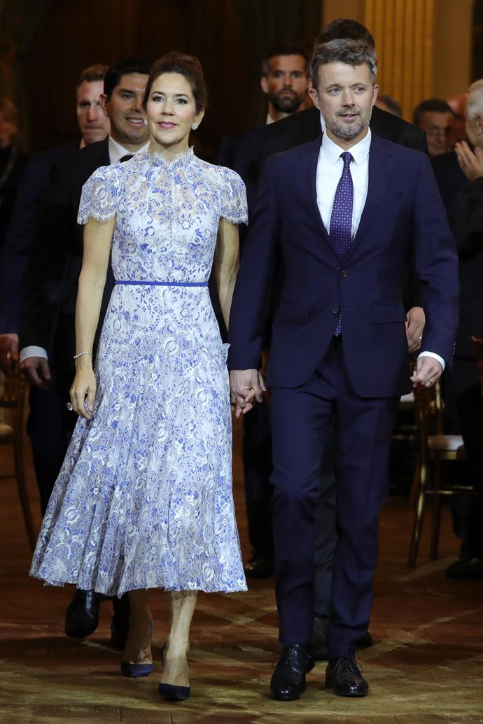 And a few hours later, her evening look knocked it out of the park once again - we're obsessed with this cap-sleeved blue embroidered gown!